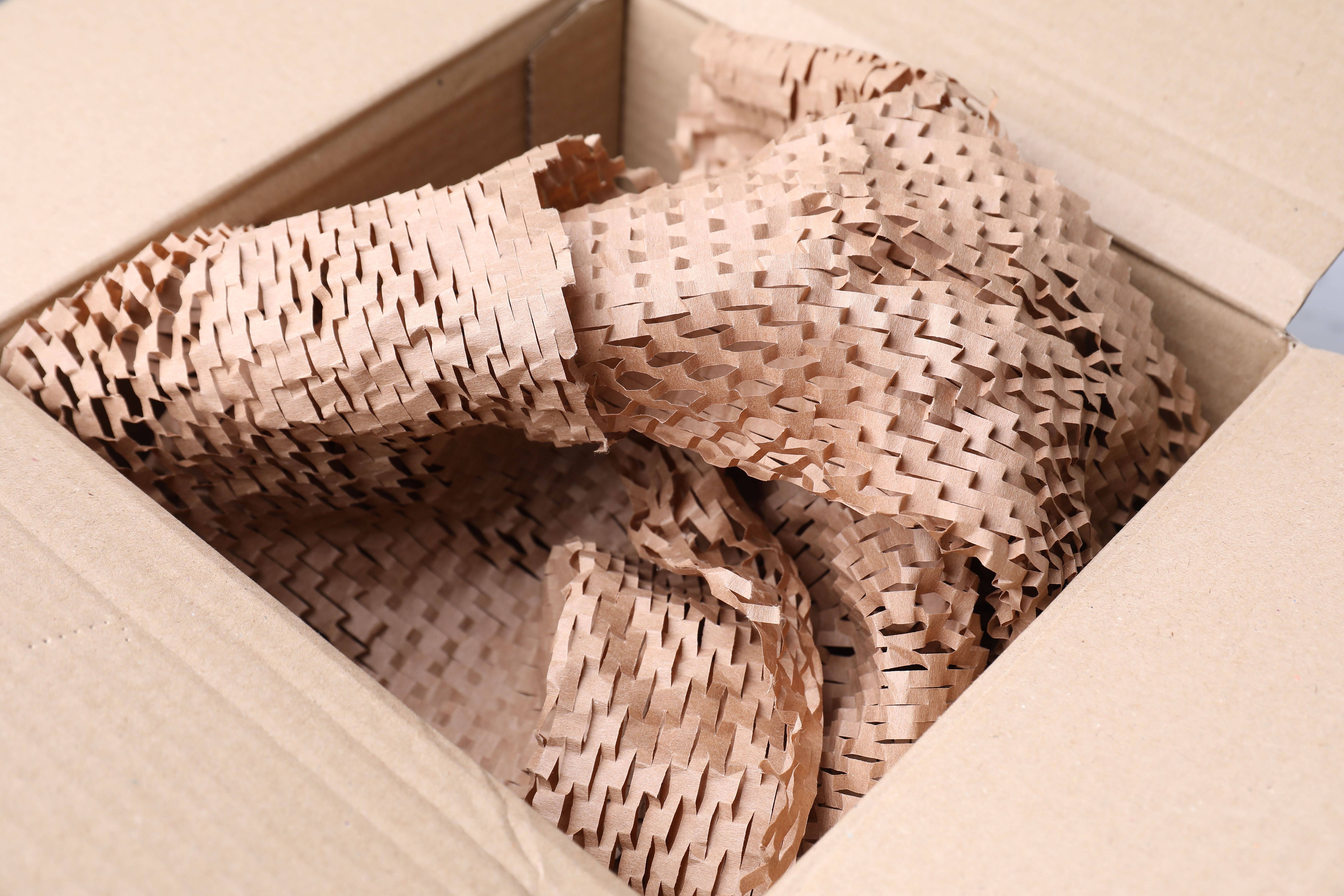 honeycomb paper packing material inside of a packing box
